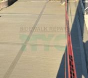 Recently repaired sidewalk with smooth, even surface and no visible damage.