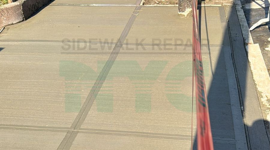 Recently repaired sidewalk with smooth, even surface and no visible damage.